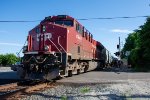 CP 8945 shoves an oil train south at Farmington Road 